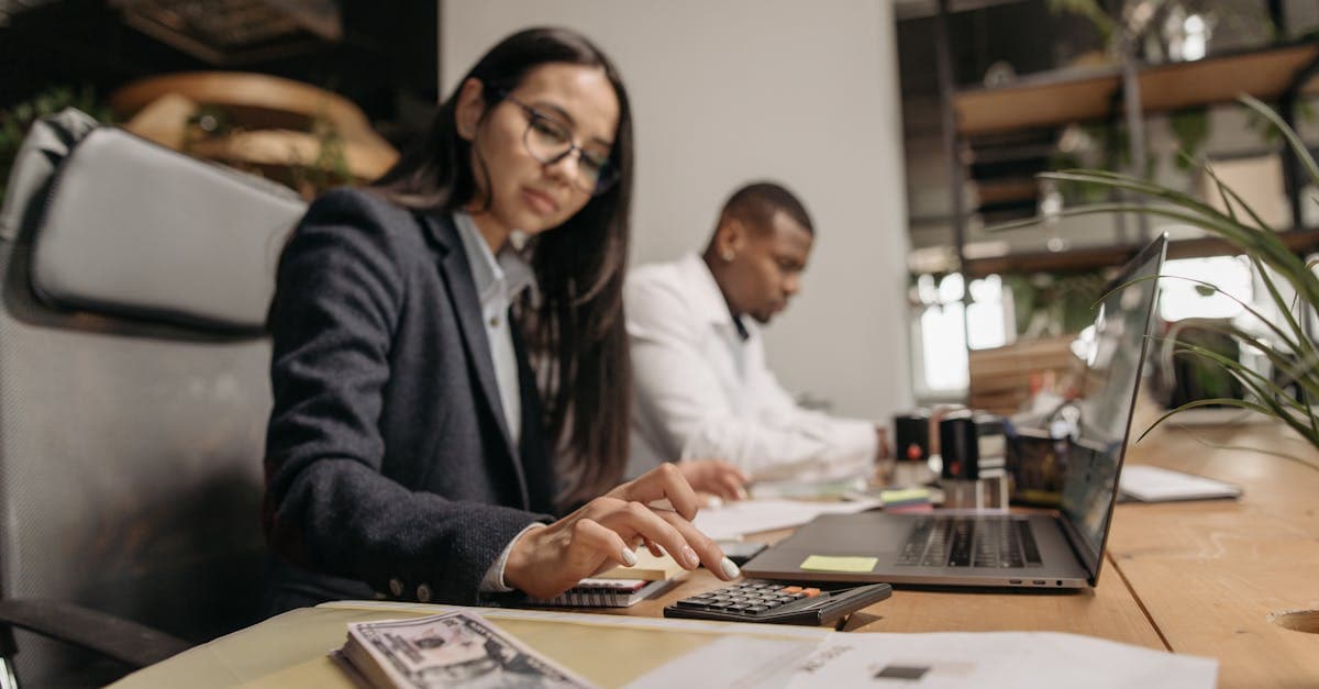 Business owner reviewing financial reports on a laptop before meeting their accountant