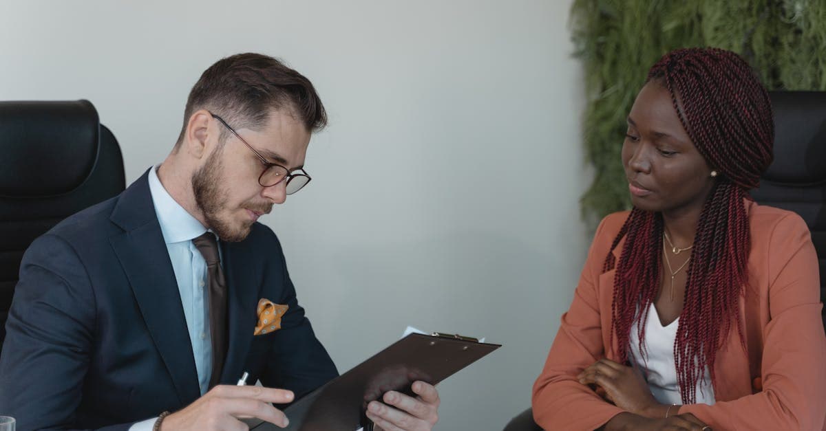 Small business owner reviewing payroll documents at a desk
