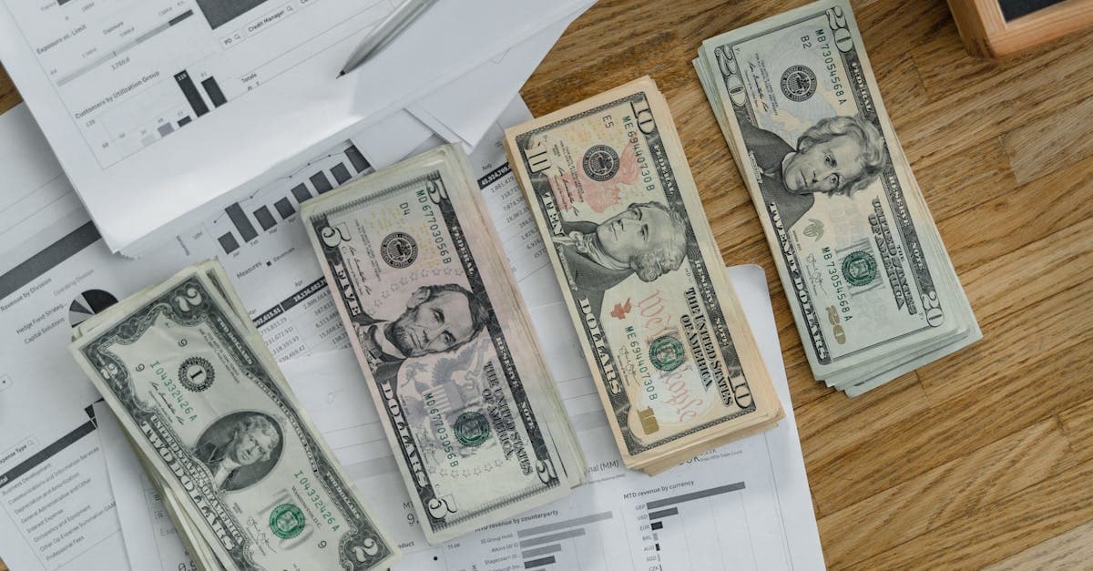 Laptop showing contractor agreement document with pen and notebook